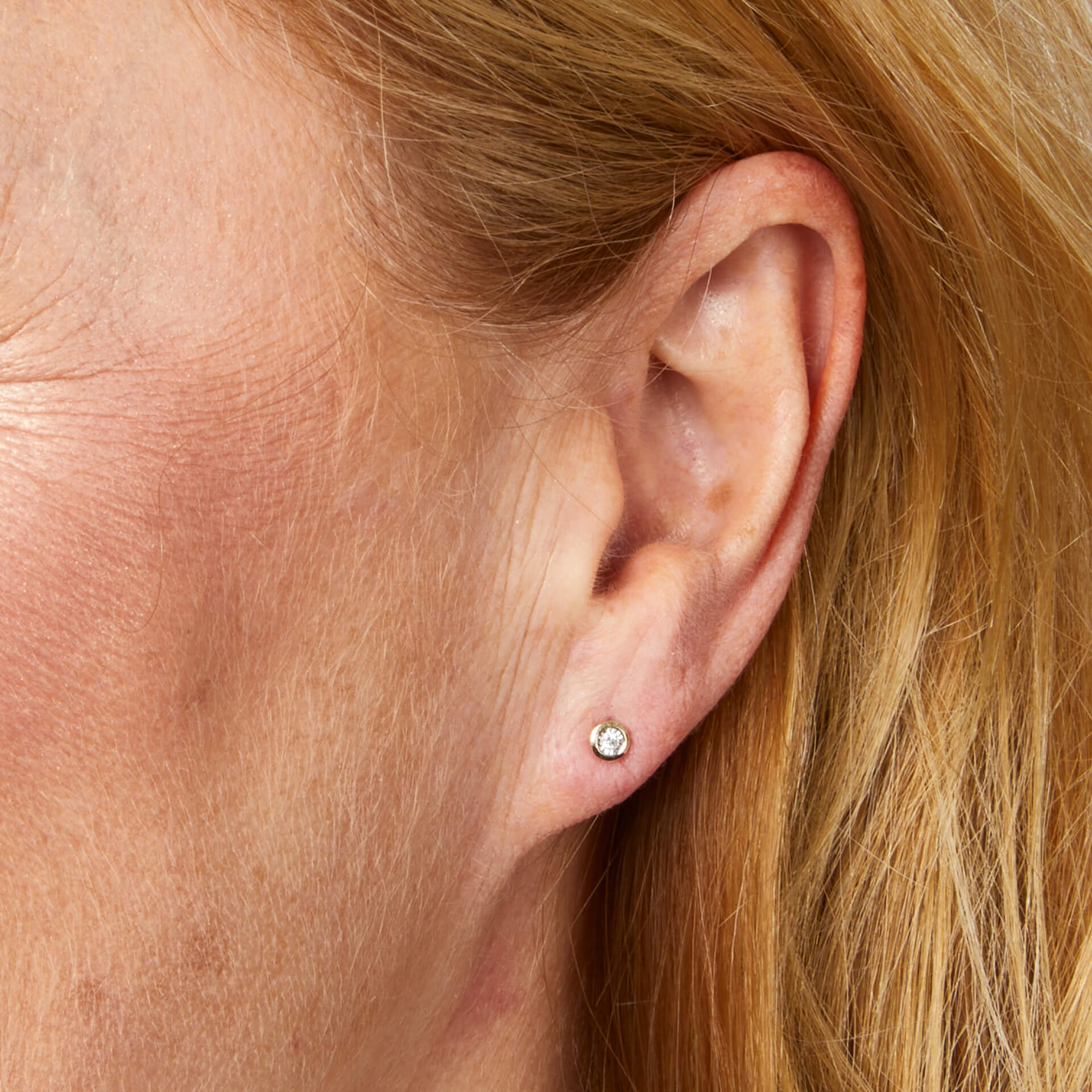 Elements Gold Rounded Bezel Diamond Stud Earrings