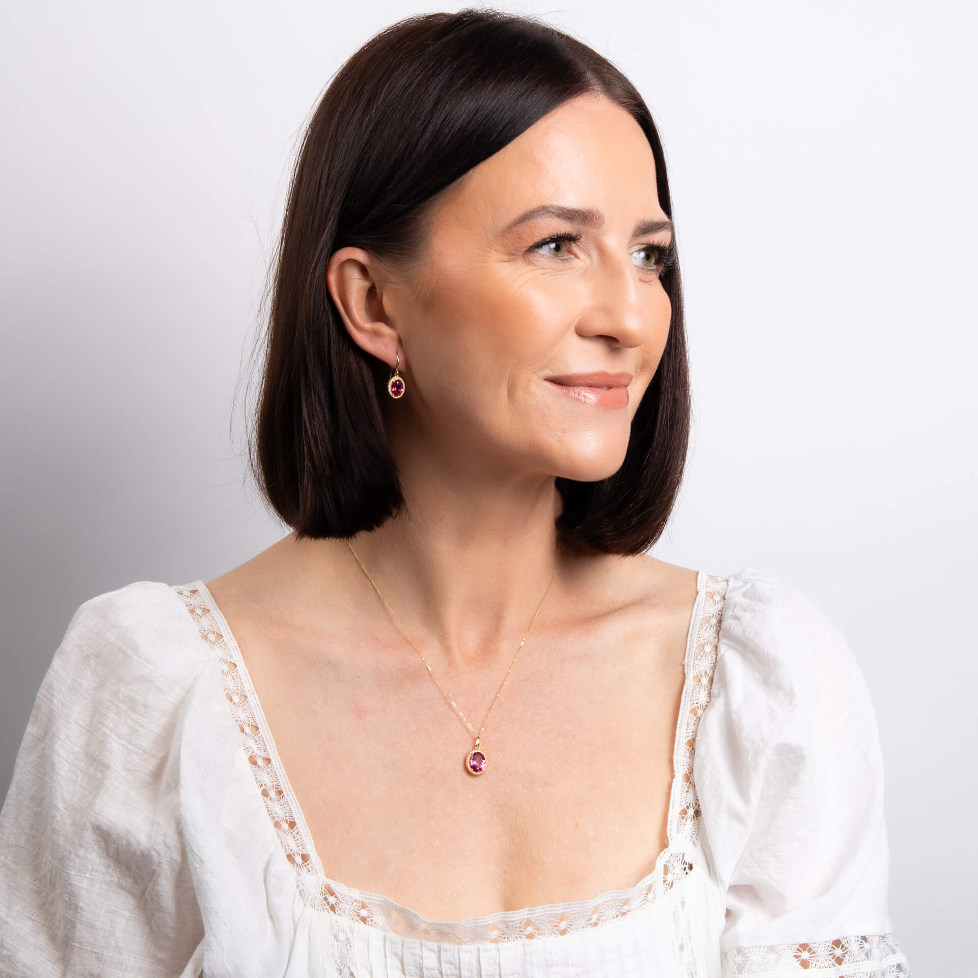 Elements Gold Oval Cut Pink Topaz Pendant