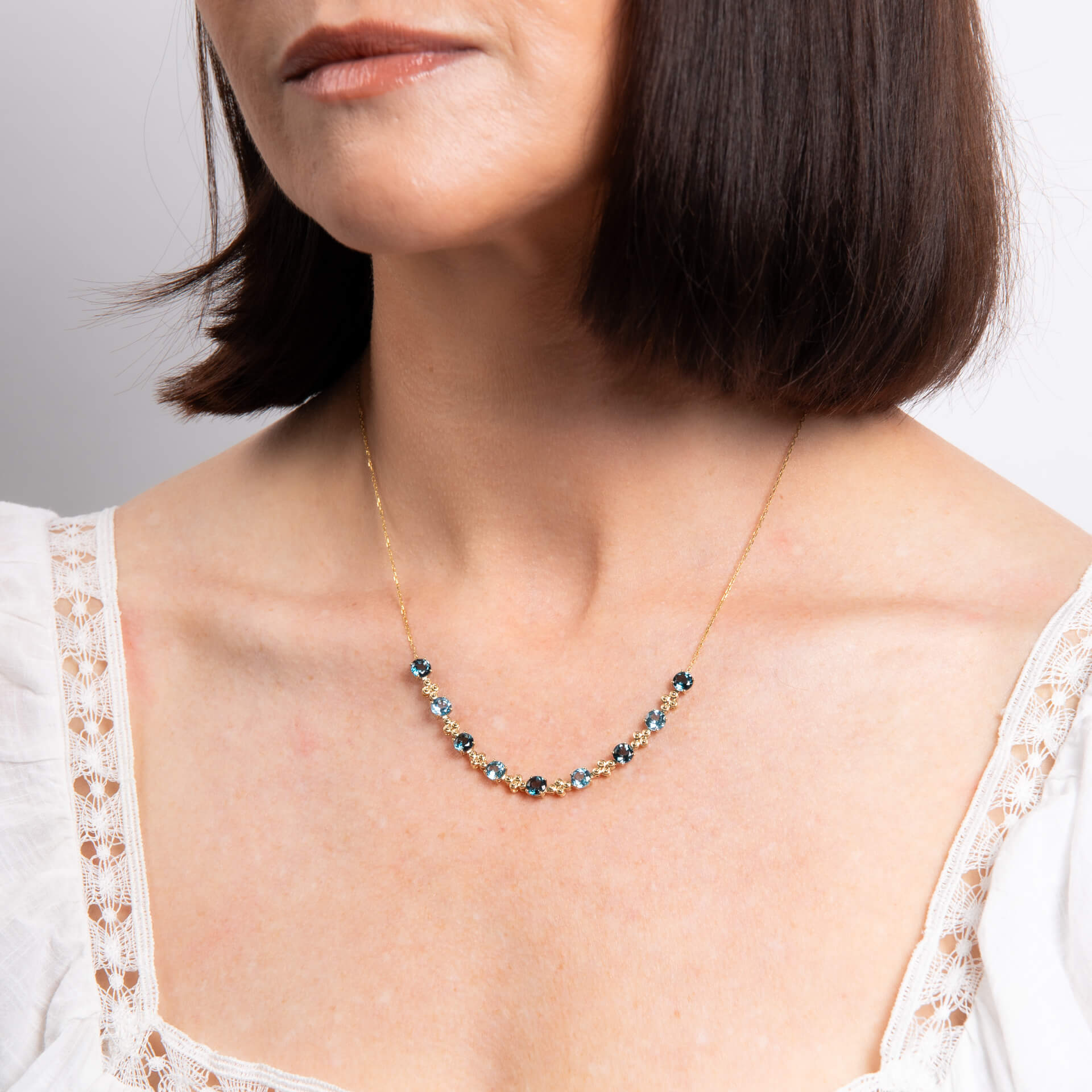 Elements Gold Ornate Blue Topaz Necklace