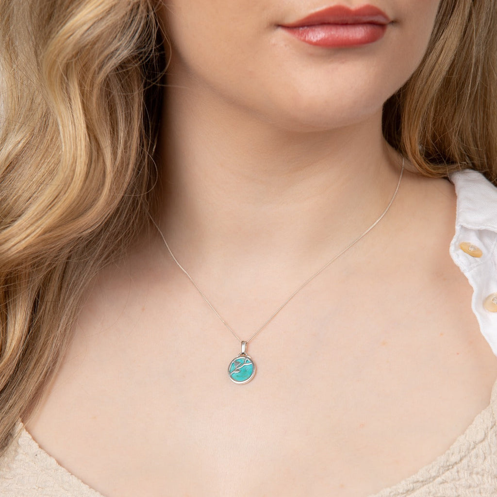 Beginnings Flower Pattern Pendant with Turquoise Background